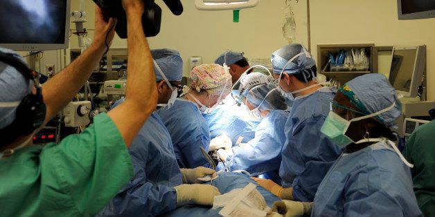 In this image provided by ABC, a cameraman records a medical procedure in an operating room in a scene from the latest season of "NY Med," premiering Thursday, June 26, 2014, at 10 p.m. EDT. (AP Photo/ABC, Donna Svennevik)