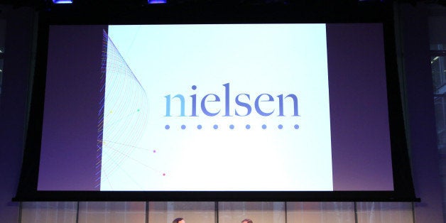 NEW YORK, NY - SEPTEMBER 30: Senior Correspondent at CBS News, Anthony Mason (L) and CEO at Nielsen, Mitch Barns speak onsta
