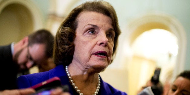 UNITED STATES - DECEMBER 09: Sen. Dianne Feinstein, D-Calif., Chairwoman of the Senate Intelligence Committee, talks with rep