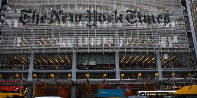 NEW YORK, NY - OCTOBER 01: Traffic drives past The New York Times building on October 1, 2014 in New York City. The Times announced plans to cut approximately 100 jobs from the newsroom today, with the company announcing it will start with buy-out packages before moving to layoffs. (Photo by Andrew Burton/Getty Images)