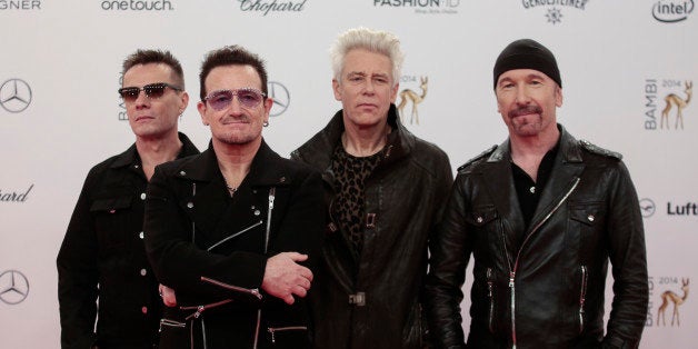 The members of Irish band U2 from left, Larry Mullan jr., Bono, Adam Clayton and The Edge arrive for the Bambi 2014 media awards in Berlin, Thursday, Nov. 13, 2014. (AP Photo/Markus Schreiber)