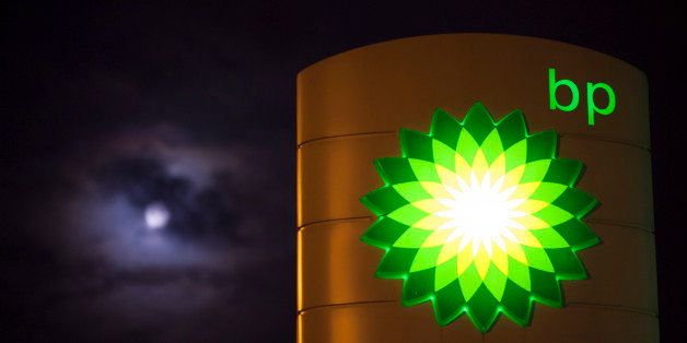 Clouds partially cover the moon beyond an illuminated BP logo as it sits on a sign outside a gas station operated by BP Plc in Guildford, U.K., on Monday, Dec. 8, 2014. Brent crude oil for January settlement climbed 67 cents to $66.86 a barrel on the London-based ICE Futures Europe exchange at 12:08 p.m. local time. after having slid $2.88 to $66.19 yesterday, the lowest close since September 2009. Photographer: Jason Alden/Bloomberg via Getty Images