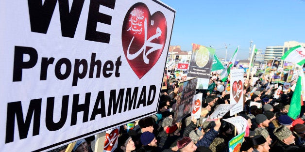 GROZNY - JANUARY 19 : Chechen Muslims gather in downtown regional capital of Grozny during a protest rally on January 19, 2015. Thousands of people have marched in the Russian region of Chechnya to rally against the French satirical magazine Charlie Hebdo. (Photo by Sefa Karacan/Anadolu Agency/Getty Images)