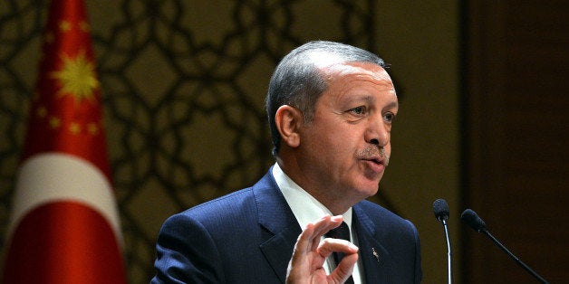 In this Thursday, Dec. 25, 2014 photo provided by the Presidential Press Service, Turkey's President Recep Tayyip Erdogan add