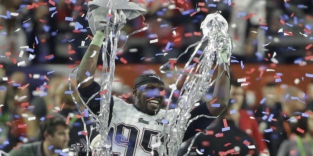 New England Patriots defensive end Chandler Jones (95) celebrates after the Patriots beat the Seattle Seahawks in the NFL Super Bowl XLIX football game Sunday, Feb. 1, 2015, in Glendale, Ariz. (AP Photo/Elise Amendola)