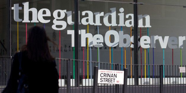 A woman walks past the offices of the Guardian newspaper in central London on August 20, 2013. The British government forced the Guardian to destroy files or face a court battle over its publication of US security secrets leaked by Edward Snowden, the paper's editor claimed. AFP PHOTO / ANDREW COWIE (Photo credit should read ANDREW COWIE/AFP/Getty Images)