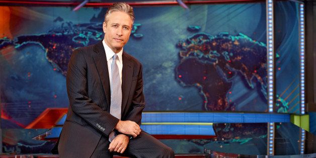 This undated image released by Comedy Central shows Jon Stewart on the set of "The Daily Show with Jon Stewart" in New York. The Comedy Central show is decamping for both the Republican and Democrat conventions to broadcast a week of shows at each that will parody the nation's most extravagant political pageants. (AP Photo/Comedy Central, Martin Crook)
