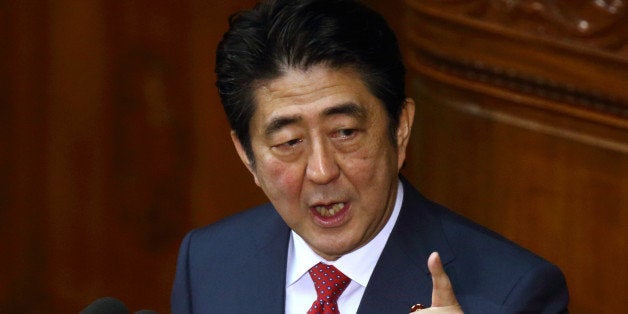 Shinzo Abe, Japan's prime minister, delivers his policy speech at the lower house of parliament in Tokyo, Japan, on Thursday, Feb. 12, 2015. Abe said he will press ahead with biggest reforms since World War II. Photographer: Tomohiro Ohsumi/Bloomberg via Getty Images 