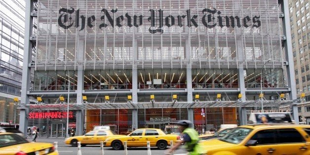 In this Oct. 18, 2011 photo, traffic passes the New York Times building, Tuesday, in New York. The publisher of The New York Times, The Boston Globe and other newspapers said Thursday, Oct. 20, 2011 that it earned $15.7 million, or 10 cents per share, in the July-September period. Thatâs up from a net loss of $4.3 million, or 3 cents per share, a year earlier. (AP Photo/Mark Lennihan)