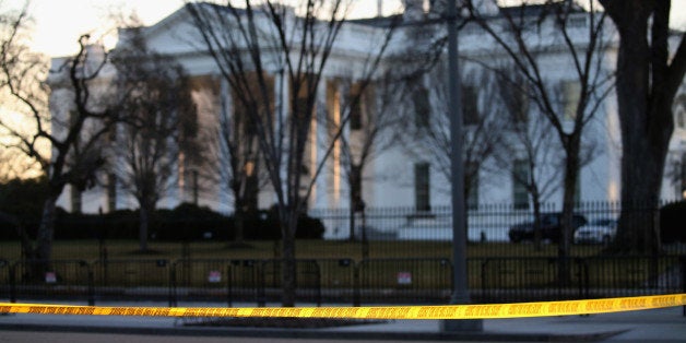 WASHINGTON, DC - MARCH 12: Yellow police tape is stretched across Pennsylvania Avenue in front of the White House, on March 12, 2015 in Washington, DC. Officials are Investigating allegations that two senior Secret Service agents drove a government car into White House security barricades after drinking at a late night party last week. (Photo by Mark Wilson/Getty Images)