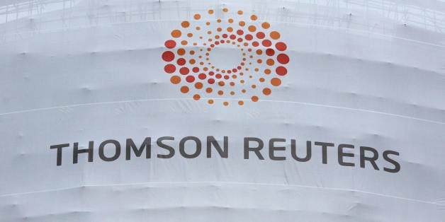 A new temporary sign is displayed on the Thomson Reuters building in Canary Wharf in London, on April 17, 2008. Thomson Reute