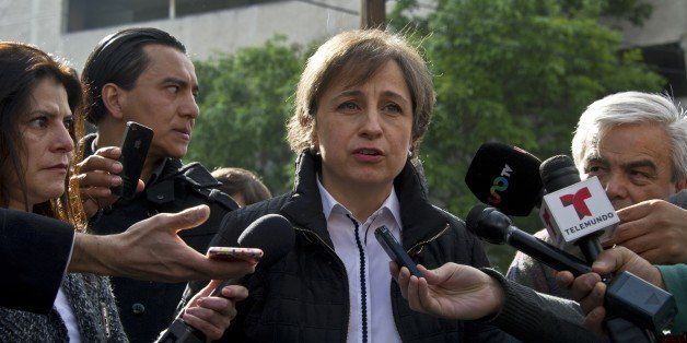 Mexican journalist Carmen Aristegui speaks to the press in Mexico City on March 16, 2015 a day after being fired. Aristegui, an influential Mexican broadcast journalist whose report about the first lady's mansion caused a scandal was sacked Sunday, sparking anger among supporters who called her firing an affront to freedom of speech. Aristegui had been publicly feuding with her employer, MVS Radio, in recent days after two of her investigative reporters were fired by the company. AFP PHOTO / RONALDO SCHEMIDT (Photo credit should read RONALDO SCHEMIDT/AFP/Getty Images)