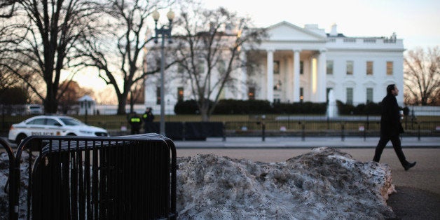 WASHINGTON, DC - MARCH 12: Melting snow and barricades sit in front of the White House on March 12, 2015 in Washington, DC. Officials are Investigating allegations that two senior Secret Service agents drove a government car into White House security barricades after drinking at a late night party last week. (Photo by Mark Wilson/Getty Images)