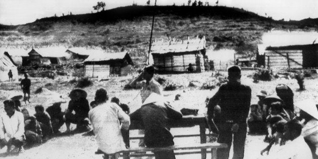 The Vietnamese flag flies over the village of Mai Lai 19 November 1969, where some 600 villagers were allegedly massacred by