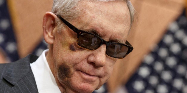 Senate Minority Leader Harry Reid of Nev. pauses during a news conference on Capitol Hill, Tuesday, Feb. 24, 2015, to urge Re