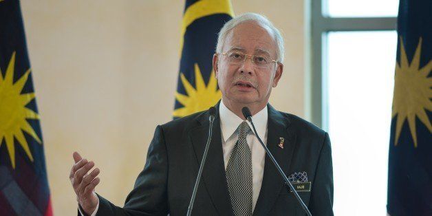 Malaysia's Prime Minister Najib Razak speaks during a joint press conference at the prime minister's office in Putrajaya, outside Kuala Lumpur on February 6, 2015. Widodo arrived in Malaysia on February 5 for his first bilateral trip abroad, with the two sides hoping to shore up an important Southeast Asian relationship frequently strained by diplomatic spats. AFP PHOTO / MOHD RASFAN (Photo credit should read MOHD RASFAN/AFP/Getty Images)