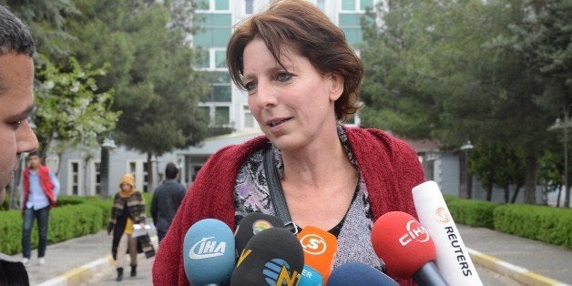 Dutch journalist Frederike Geerdink leaves the Diyarbakir courthouse on April 13, 2015 in the southeastern city of Diyarbakir. A judge was to give his verdict in the trial of Geerdink accused of spreading 'terrorist propaganda' for the banned Kurdistan Workers' Party (PKK). She is expected to be acquitted after prosecutors asked for her to be exonerated. AFP PHOTO / ILYAS AKENGIN (Photo credit should read ILYAS AKENGIN/AFP/Getty Images)