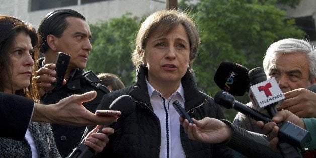 Mexican journalist Carmen Aristegui speaks to the press in Mexico City on March 16, 2015 a day after being fired. Aristegui, an influential Mexican broadcast journalist whose report about the first lady's mansion caused a scandal was sacked Sunday, sparking anger among supporters who called her firing an affront to freedom of speech. Aristegui had been publicly feuding with her employer, MVS Radio, in recent days after two of her investigative reporters were fired by the company. AFP PHOTO / RONALDO SCHEMIDT (Photo credit should read RONALDO SCHEMIDT/AFP/Getty Images)