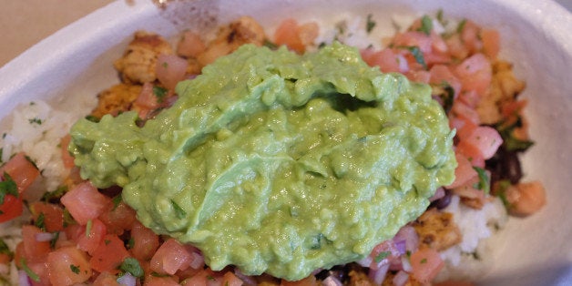 MIAMI, FL - MARCH 05: Guacamole sits on a dish at a Chipotle restaurant on March 5, 2014 in Miami, Florida. The Mexican fast