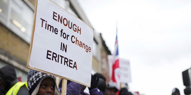 TO GO WITH AFP STORY BY BEATRICE DEBUT
Eritrean demonstrators hold banners during a protest against the Eritrean regime in c