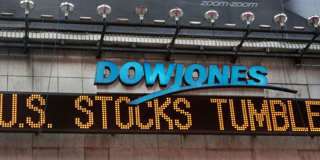 A zipper on the side of One Times Square announces a stock selloff on Wall Street in New York, Wednesday, Oct. 15, 2014. A mo