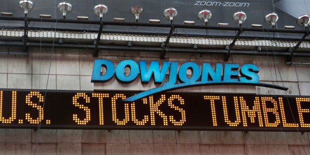 A zipper on the side of One Times Square announces a stock selloff on Wall Street in New York, Wednesday, Oct. 15, 2014. A monthlong drop in U.S. stocks intensified in afternoon trading Wednesday, sending the Dow Jones industrial average down more than 400 points and putting the index on track for its biggest loss in more than a year. (AP Photo/Kathy Willens)