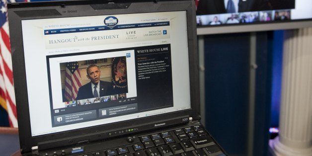 US President Barack Obama participates in an interview with YouTube and Google from the Roosevelt Room of the White House in Washington, DC, January 30, 2012, as seen on a laptop in the Brady Press Briefing Room. The interview, held through a Google+ Hangout, marks the first completely virtual interview of a US President from the White House. AFP PHOTO / Saul LOEB (Photo credit should read SAUL LOEB/AFP/Getty Images)