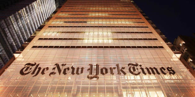 The New York Times building is shown Wednesday, Oct. 21, 2009 in New York. The New York Times Co. is reporting a loss for the most recent quarter. It was hurt by one-time charges and the continuing ad slump. (AP Photo/Mark Lennihan)