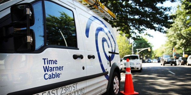 NEW YORK, NY - AUGUST 27: A Time Warner Cable truck is viewed in Brooklyn on August 27, 2014 in New York City. Time Warner Cable, which has 11.4 million subscribers in the United States, suffered a massive power outage Wednesday morning across the nation. While customers appeared to have power back by mid-morning, thousands had lost internet service for the duration of the outage. In a deal that is valued at $45.2 billion, Time Warner Cable is attempting to merge with Comcast. (Photo by Spencer Platt/Getty Images)