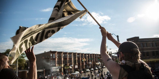 BALTIMORE, MD - MAY 02: Protesters march from City hall to the Sandtown neighborhood May 2, 2015 in Baltimore, Maryland. Fred
