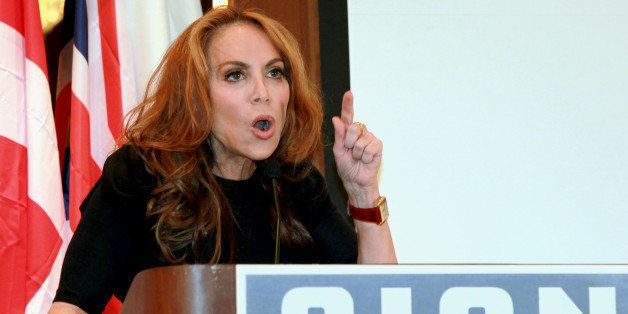 In this Sept. 11, 2012 photo, anti-Islamic blogger Pamela Geller, speaks at a conference she organized entitled; âStop Islamization of America,â in New York. An advertising campaign initiated by Gellerâs group, âThe American Freedom Defense Initiative,â will have its ads that equate foes of Israel with âsavagesâ appearing in 10 New York City subway stations after a federal judge ordered the Metropolitan Transportation Authority to put them up. (AP Photo/David Karp)