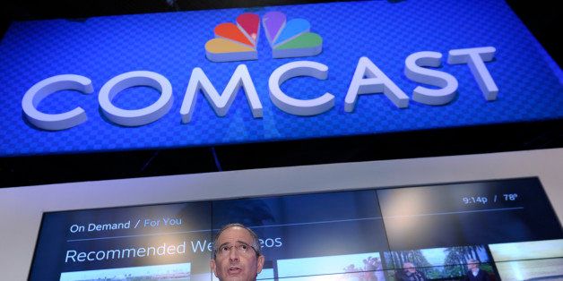 Comcast Corp. CEO Brian Roberts gestures as he speaks during The Cable Show 2013 convention in Washington, Tuesday, June 11, 2013. The nation's largest cable TV provider, Comcast Corp., unveiled a new, compact set-top box that does away with the hard drive and saves your TV shows online. (AP Photo/Susan Walsh)