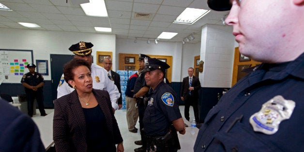 Attorney General Loretta Lynch meets with Baltimore police officers during a visit to the Central District of Baltimore Polic