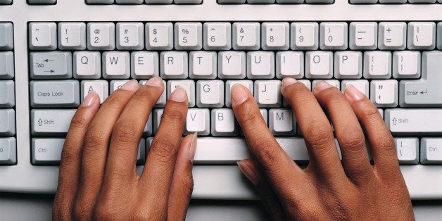 Hands Typing on Computer Keyboard