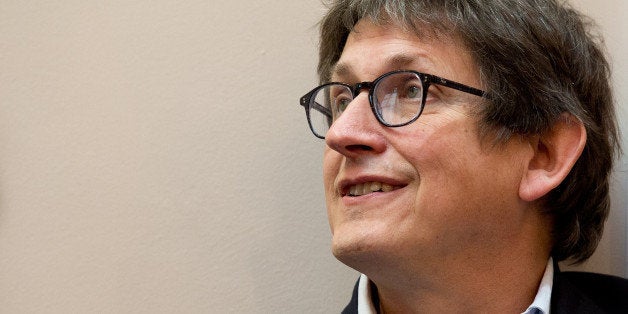 Guardian newspaper editor Alan Rusbridger is pictured before the start of a press conference in London, on December 2, 2013,