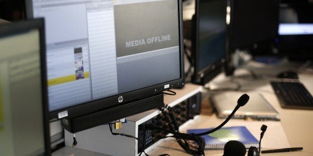 A picture taken on April 9, 2015 shows computer screens at French television network TV5Monde headquarters in Paris, after TV