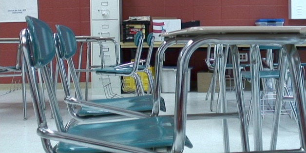 In this image made from video, chairs sit empty in a classroom of Hunt Elementary School in Fort Valley, Ga., on Monday, May