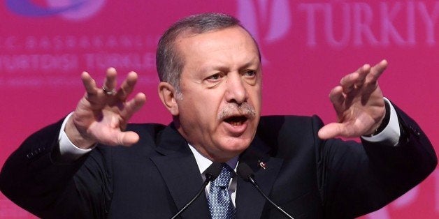 Turkey's President Tayyip Erdogan makes a speech during a graduation ceremony in Ankara, on June 11, 2015. Erdogan called on June 11, for the formation of a new coalition government as soon as possible, ending almost four days of unusual silence after legislative polls seen as a blow to his authority. AFP PHOTO/ADEM ALTAN (Photo credit should read ADEM ALTAN/AFP/Getty Images)