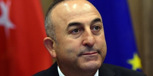 Turkey's Foreign Minister Mevlut Cavusoglu poses prior to take part in an EU-Turkey association council at the European Counc