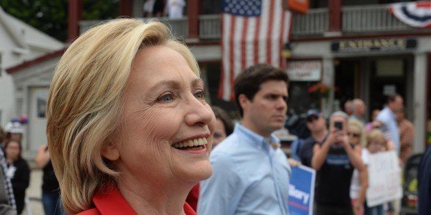 GORHAM, NH - JULY 4: Democratic presidental candidate Hillary Clinton marches in the Gorham fourth of July parade July 4, 2015 in Gorham, New Hampshire. Clinton is on a two day swing through the first in the nation primary state over the fourth of July holiday.(Photo by Darren McCollester/Getty Images)
