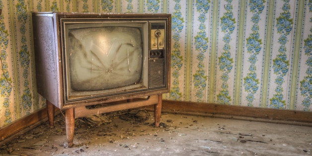 Abandoned TV in a derelict house.