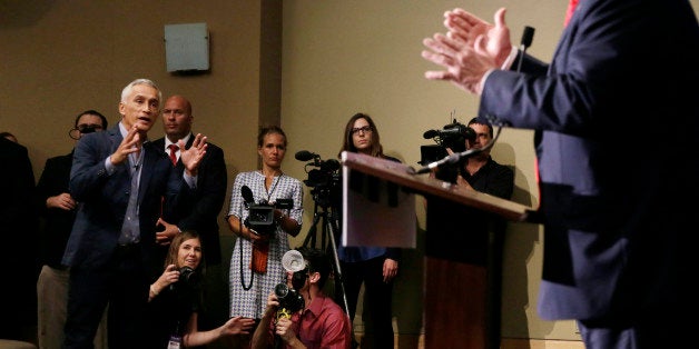 Miami-based Univision anchor Jorge Ramos, left, asks Republican presidential candidate Donald Trump a question about his immi