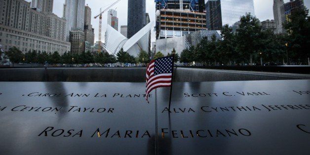 A US flag is placed on the 9/11 memorial before the ceremony to commemorate the 14th Anniversary of the terrorist attacks on September 11, 2015 in New York. AFP PHOTO/KENA BETANCUR (Photo credit should read KENA BETANCUR/AFP/Getty Images)