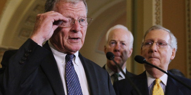 WASHINGTON, DC - JULY 21: Senate Environment and Public Works Chairman James Inhofe (R-OK) talks with reporters about a proposed highway funding bill after the weekly Senate Republican policy luncheon with Majority Leader Mitch McConnell (R-KY) (R) and Sen. John Cornyn (R-TX) at the U.S. Capitol July 21, 2015 in Washington, DC. McConnell announced that he had reached a deal with Senate Environment and Public Works Committee ranking member Sen. Barabara Boxer (D-CA) on a long-term highway funding bill, but Senate Democrats said they will not support the bill without more time to read it or propose amendments. (Photo by Chip Somodevilla/Getty Images)