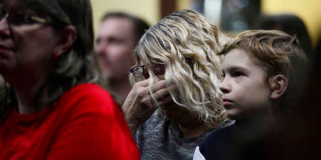 COLORADO SPRINGS, CO - NOVEMBER 29: Tracy Gilliland cries while they talk about Officer Garrett Swasey at Hope Chapel on Nove
