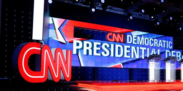 Michelle Poley walks on stage before a CNN Democratic presidential debate, Tuesday, Oct. 13, 2015, in Las Vegas. Democratic presidential candidates, Hillary Rodham Clinton, Jim Webb, Bernie Sanders, Lincoln Chafee, and Martin O'Malley will take the stage later today. (AP Photo/John Locher)