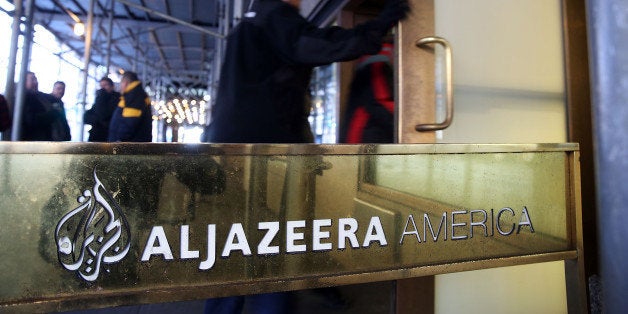 NEW YORK, NY - JANUARY 13: People walk into the offices of Al Jazeera America, a cable news channel that debuted in August 2013 on January 13, 2016 in New York City. Al Jazeera America announced today that they are shutting down. Employees of the struggling news network known as AJAM were informed of the decision during an all-hands staff meeting on Wednesday afternoon. (Photo by Spencer Platt/Getty Images)