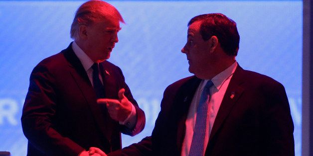 Republican presidential candidate, businessman Donald Trump, left, and Republican presidential candidate, New Jersey Gov. Chris Christie talk during a commercial break during a Republican presidential primary debate hosted by ABC News at the St. Anselm College Saturday, Feb. 6, 2016, in Manchester, N.H. (AP Photo/David Goldman)