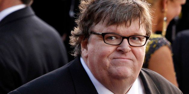 Michael Moore arrives before the 84th Academy Awards on Sunday, Feb. 26, 2012, in the Hollywood section of Los Angeles. (AP Photo/Joel Ryan)