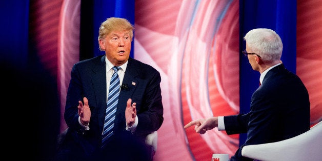 Republican presidential candidate Donald Trump speaks with Anderson Cooper at a CNN town hall at the University of South Carolina in Columbia, S.C., Thursday, Feb. 18, 2016. (AP Photo/Andrew Harnik)